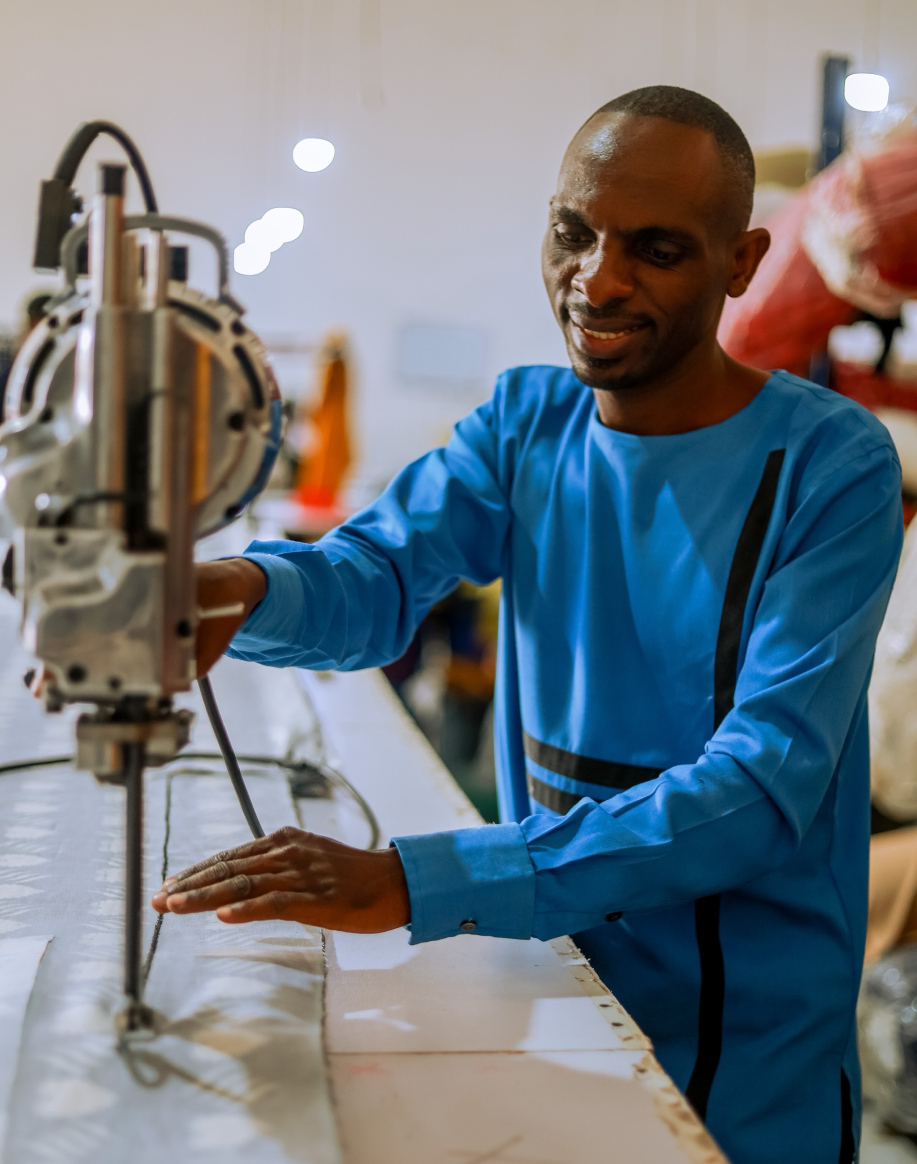 Cutting fabric at the Waya Collective factory